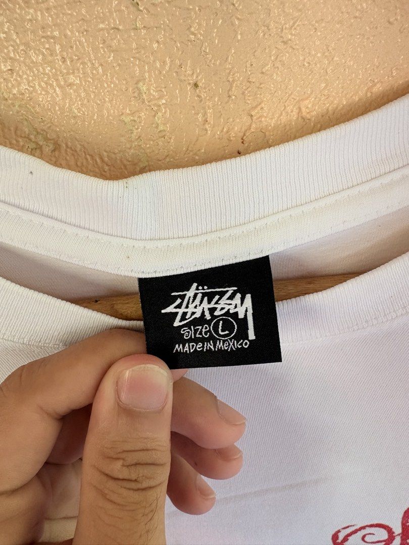 Stüssy 80 Laguna Graphic Tee White Size L (Category: Tshirts & Polo Shirts ) located in Pozorrubio. Submitted by zionegotthrift (Listing ID 1469200664, Image 3). Description: - Brand: Stüssy - Color: White - Size: Large - Material: 100% Cotton (Made in Mexico) - Design: Small script logo on left chest, big liquid bubble '80 Laguna' graphic on the back - Fit: Standard crew neck short sleeve.