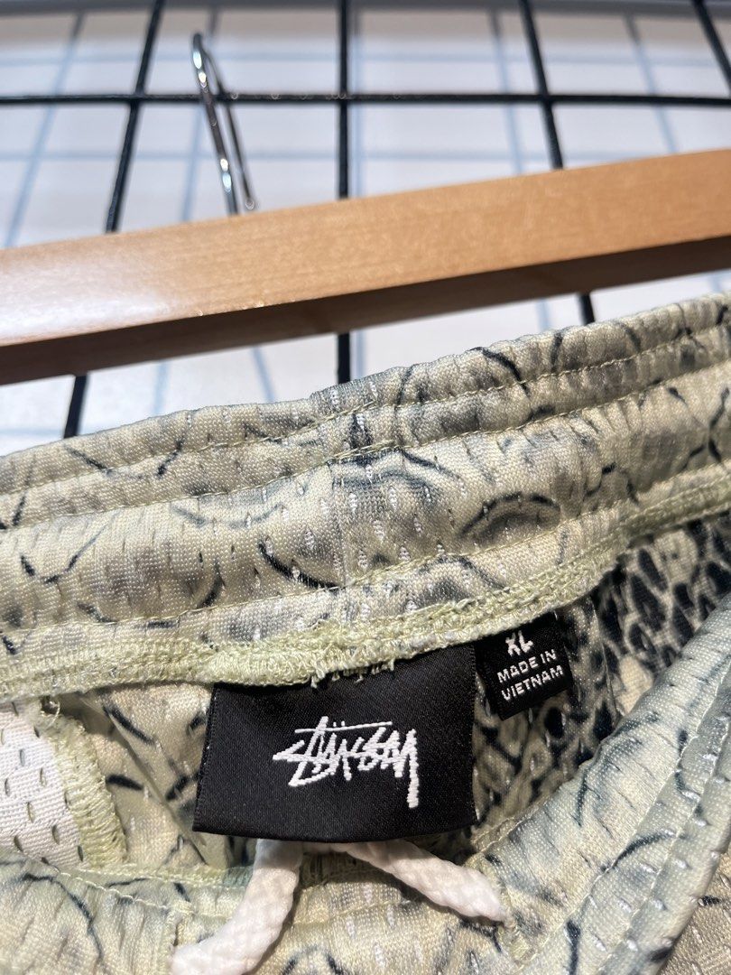 Stüssy Snake Mesh Shorts (Category: Shorts) located in Taal. Submitted by thrift_deals23 (Listing ID 1469183831, Image 3). Description: - Brand: Stüssy - Item: Allover Snakeskin Print Mesh Shorts - Size: XL - Color/Print: Snakeskin with black graffiti logo on left leg - Features: Elastic waistband, white inner drawstring, inner mesh lining - Condition: Brand new with tags attached - Origin: Made in Vietnam - Style Number: 1140340.