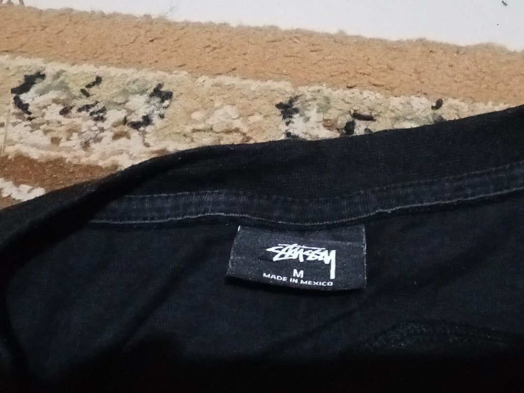 Stussy World Chapter Black T-Shirt Medium (Category: Tshirts & Polo Shirts ) located in Manila. Submitted by okellorrai95403 (Listing ID 1469285069, Image 3). Description: - Brand: Stussy - Color: Black - Size: Medium (Made in Mexico) - Material: 100% Cotton - Design: Small front logo with large graphic text print on the back - Measurements: 21" width x 24" length - Condition: Excellent, well-maintained.