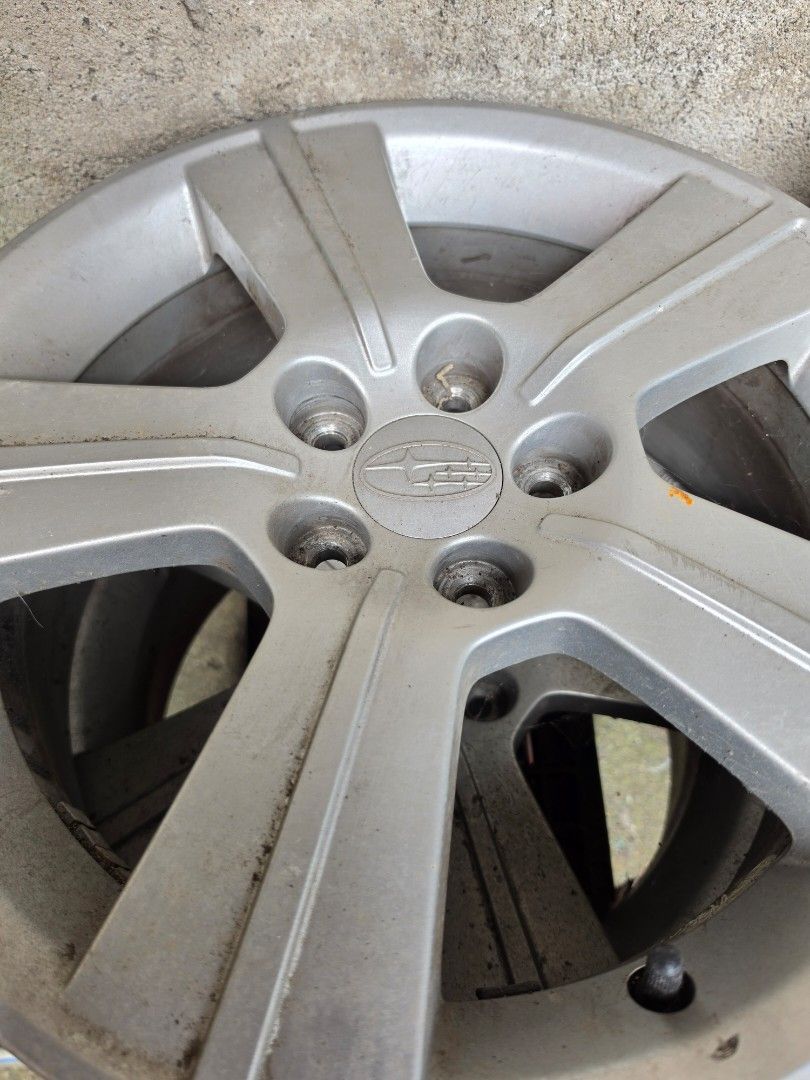 Subaru Stock Mags (Category: Mags and Tires) located in Valenzuela. Submitted by brightshark_c31a69 (Listing ID 1469192675, Image 2). Description: - Authentic Subaru stock mags (Set of 4) - Classic silver finish with multi-spoke design - Included center caps with Subaru logo - Shows normal signs of previous use and cosmetic wear; solid and sturdy build - Ideal replacement or spare set - Pickup near Malanday Valenzuela.