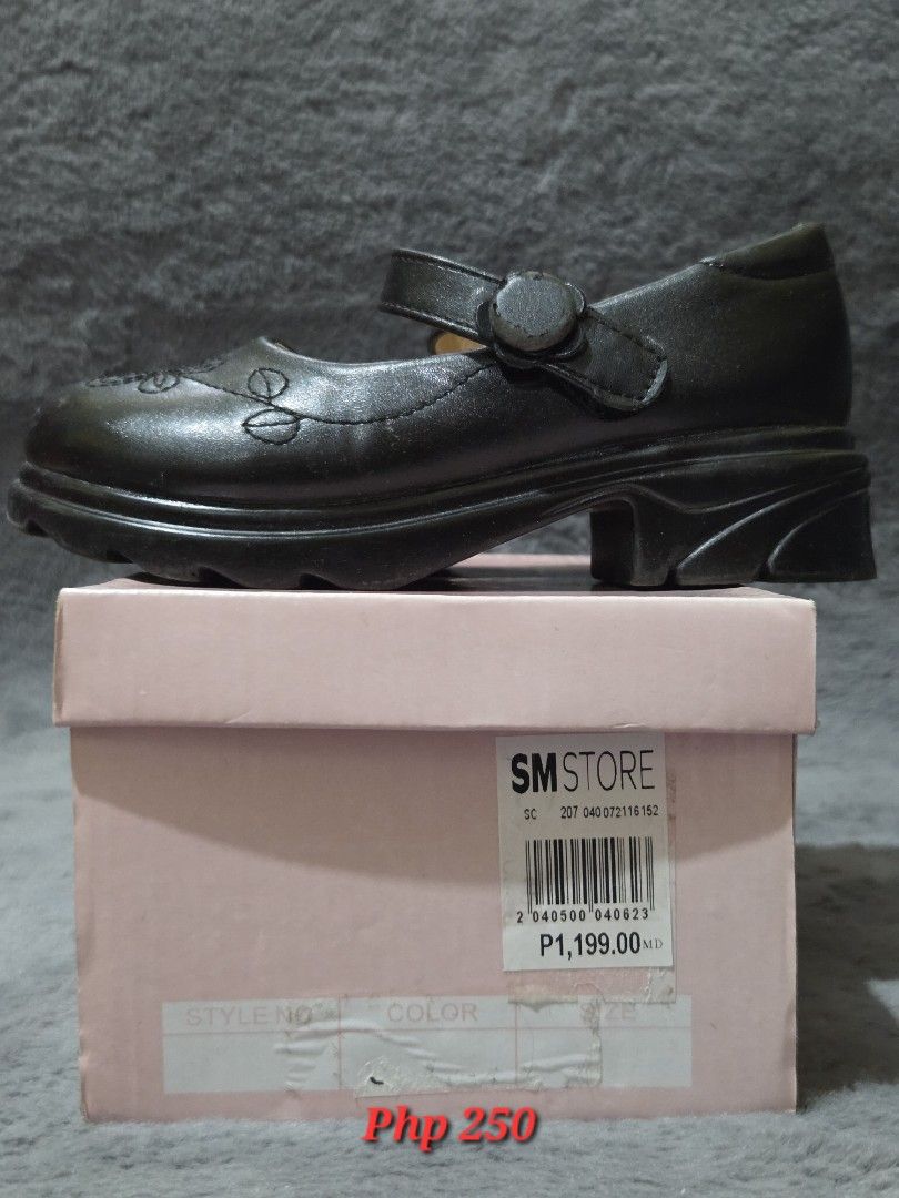 Suki Kids School Shoes (Category: Babies & Kids Fashion) located in Bulacan. Submitted by gtrvddg (Listing ID 1469247989, Image 1). Description: -Brand: Suki Kids -Size: 29 - Style: Black Mary Jane shoes with thick chunky heels and platform soles - Detail: Charming floral stitching on the toe area and a secure buckled strap - Condition: Slightly peeled off strap - Packaging: Includes original SM Store pink shoebox - Original Price: 1,199 PHP.