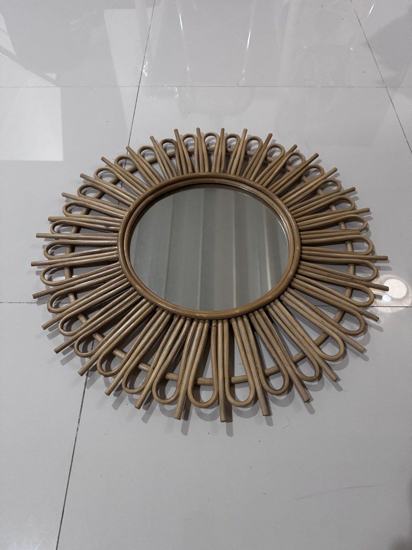 Sunburst Rattan Wall Mirror Boho Decor (Category: Mirrors) located in Taguig. Submitted by xervin (Listing ID 1469267395, Image 1). Description: - Material: Natural rattan frame with sturdy wooden backing - Design: Sunburst/daisy style with looped cane rays - Ready to hang: Includes a built-in hanging cord - Lightweight: Easy to mount in any room - Aesthetic: Neutral wood tone ideal for boho, minimalist, or rustic spaces - mirror only diameter - 