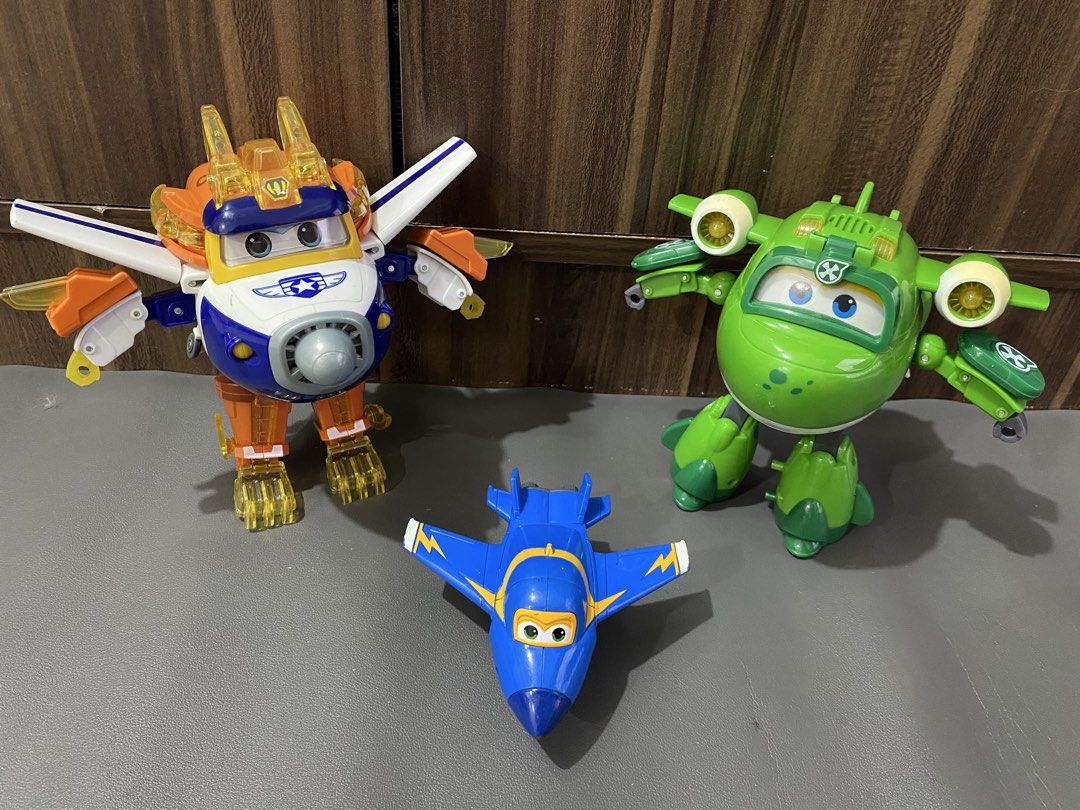 Super Wings Transform-a-Bots figures and plane Battery operated working (Category: Kids Toys) located in Manila. Submitted by declutterthingzzz (Listing ID 1469319058, Image 1). Description: - Super Wings toys: Donnie, Dizzy, and a small blue jet - Figures easily transform between vehicles and standing modes - Great for creative playtime adventures - Clean condition with minimal normal wear Price starts at 150.