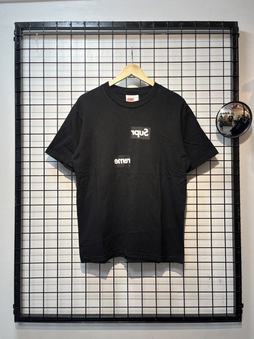 Supreme x Comme des Garçons SHIRT Split Box Logo Tee (Category: Tshirts & Polo Shirts ) located in Taal. Submitted by thrift_deals23 (Listing ID 1469184312, Image 1). Description: - Brand: Supreme x Comme des Garçons SHIRT - Item: Split Box Logo Tee - Color: Black - Size: Medium - Material: Cotton with woven interior labels - Design: Iconic upside-down text graphics and split box logo - Condition: Clean, graphics intact, highly sought-after stree
