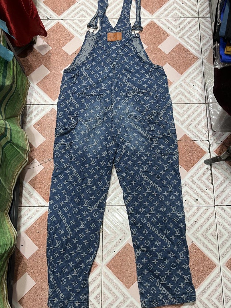 Supreme x Louis Vuitton Monogram Denim Overalls (Category: Luxury Apparel) located in Tabuk. Submitted by collectors_thrift_shop (Listing ID 1469167842, Image 3). Description: - Designer collab: Supreme x Louis Vuitton monogram print on heavy blue denim - Adjustable shoulder straps with durable metal buckles - Functional design with multiple utility pockets on front and back - patch on the back waist - Comfortable straight-leg fit for everyday we