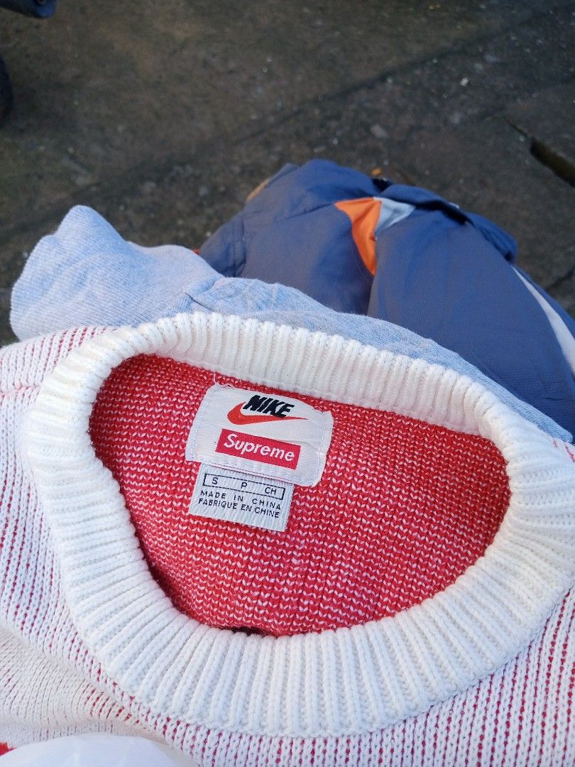 Supreme x Nike Sweater Red White Size S (Category: Coats, Jackets and Outerwear) located in Boston. Submitted by johnpaulvi30029 (Listing ID 1469166223, Image 2). Description: - Brand: Supreme x Nike Collaboration - Colorway: White and Red with big red chest swoosh - Size: S (Small) - Material: 100% acrylic - Details: Ribbed collar with co-branded inner tag - Authenticity: Style code BV7549-133 visible on inner tag - Origin: Made in China.