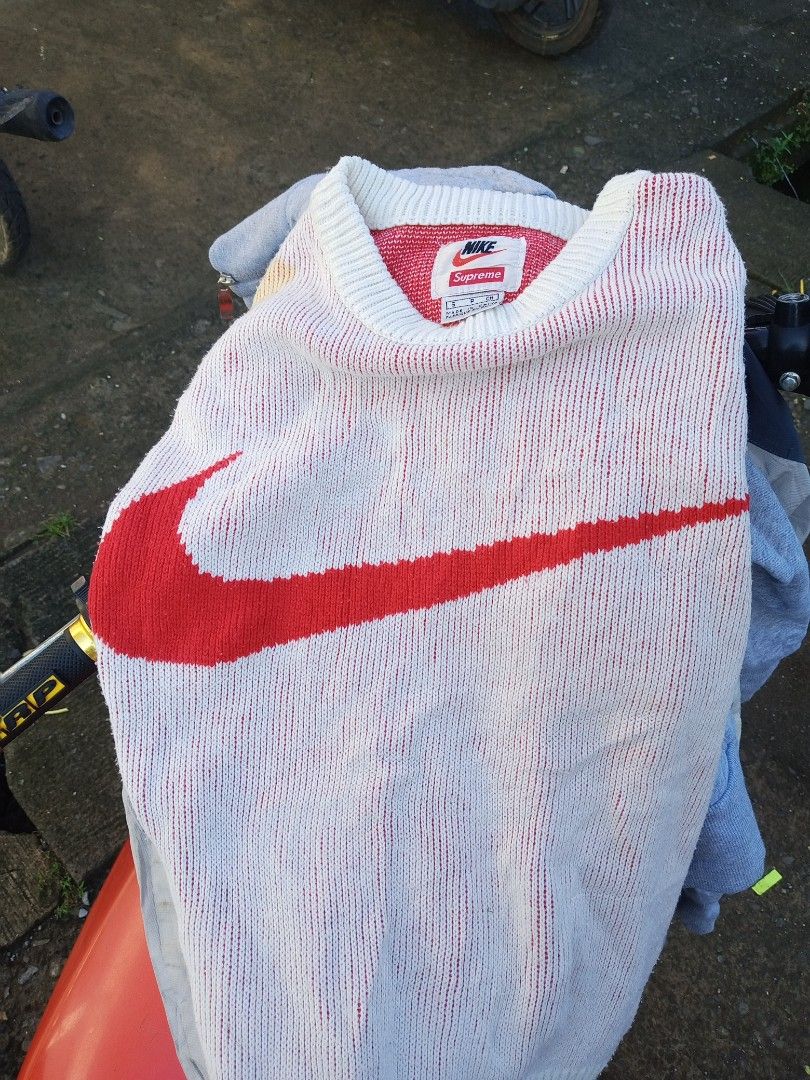 Supreme x Nike Sweater Red White Size S (Category: Coats, Jackets and Outerwear) located in Boston. Submitted by johnpaulvi30029 (Listing ID 1469166223, Image 1). Description: - Brand: Supreme x Nike Collaboration - Colorway: White and Red with big red chest swoosh - Size: S (Small) - Material: 100% acrylic - Details: Ribbed collar with co-branded inner tag - Authenticity: Style code BV7549-133 visible on inner tag - Origin: Made in China.