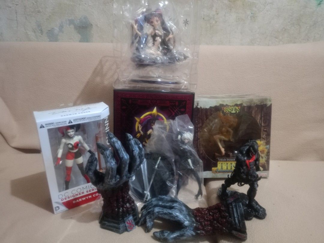(take all) Assorted Collectible Action Figures and Anime Statues (Category: Figurines & Statues) located in Subic. Submitted by larutoys (Listing ID 1469206474, Image 1). Description: - Mixed anime and comic figure collection bundle - Includes DC Comics Designer Series Harley Quinn, Berserk hand props, Venom figure, and Dragon's Crown figure - Condition: Multiple items in original boxes, some sealed in plastic packaging - Includes all original ac