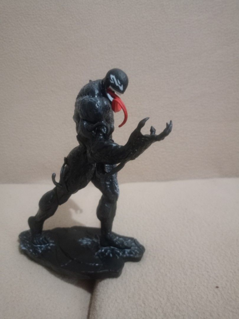 (take all) Assorted Collectible Action Figures and Anime Statues (Category: Figurines & Statues) located in Subic. Submitted by larutoys (Listing ID 1469206474, Image 2). Description: - Mixed anime and comic figure collection bundle - Includes DC Comics Designer Series Harley Quinn, Berserk hand props, Venom figure, and Dragon's Crown figure - Condition: Multiple items in original boxes, some sealed in plastic packaging - Includes all original ac