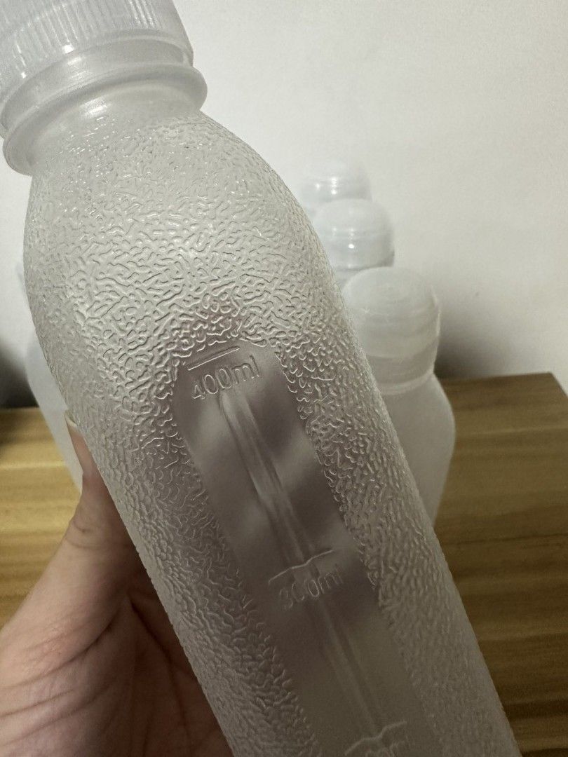 TAKE All! Frosted Plastic Squeeze Bottle (Category: Water Bottles & Tumblers) located in Pasig City. Submitted by bunny.bella (Listing ID 1469266582, Image 2). Description: - Capacity: Up to 500ml with clear measurement scale - Design: Square base with textured grip body - Cap: Clear flip-top cap with secure seal - Material: Reusable frosted plastic - Best for: Cold beverages, juices, and homemade drinks - Condition: Like new, Tried but i needed 