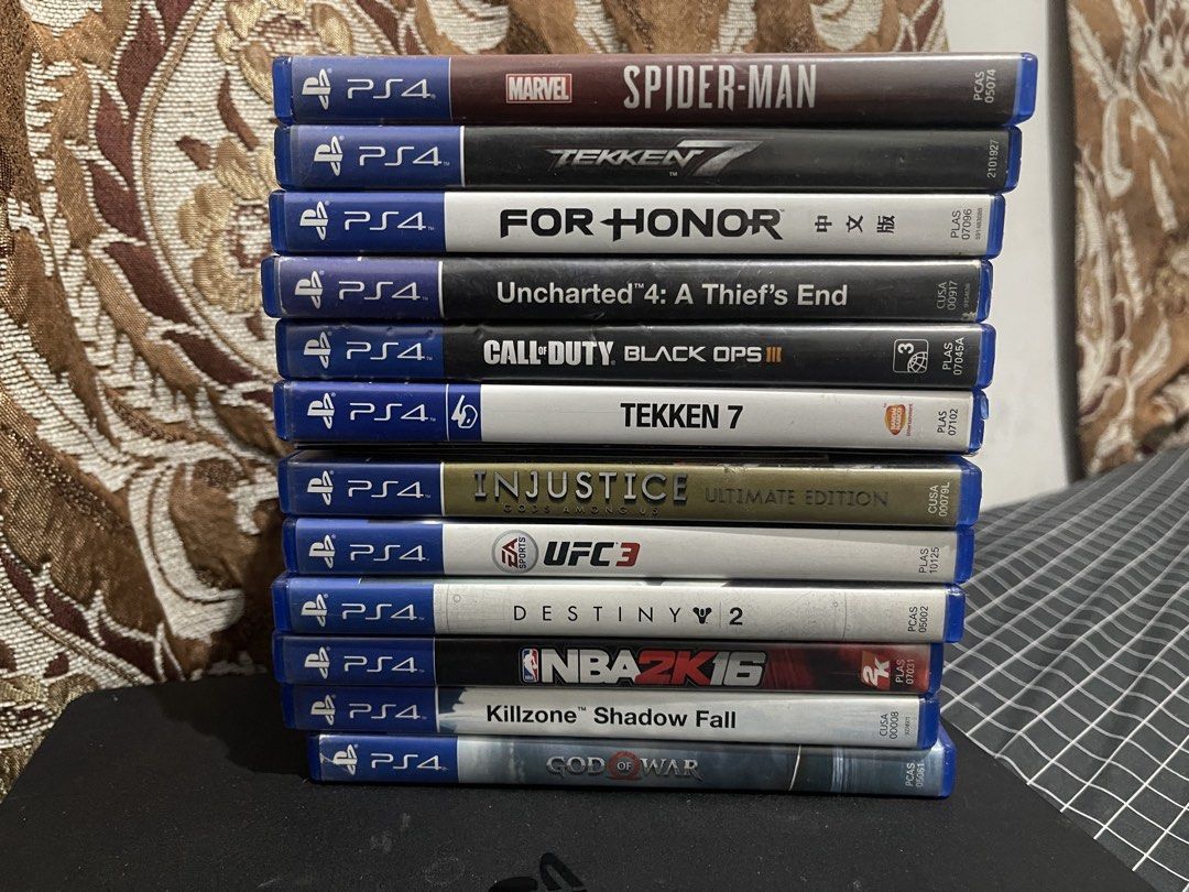 (Take all) ps4 500gb 12 games 2 controller (Category: PlayStation) located in Rizal. Submitted by percydwom (Listing ID 1469253309, Image 2). Description: - Item: Black PlayStation 4 Console Bundle - Controllers: 2x DualShock 4 controllers (both feature stickers on the right grip area) - Games Included (12 Physical Discs): Marvel's Spider-Man, Tekken 7 (2 copies), For Honor, Uncharted 4: A Thief's End, Call of Duty: Black Ops III, Injustice: Ulti