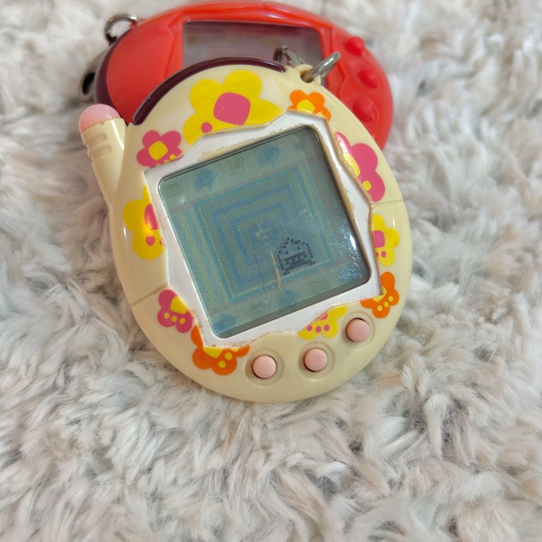 Tamagotchi Akai and Keitai Bundle (Category: Interactive Toys) located in Marikina City. Submitted by majo-esguerra (Listing ID 1469179062, Image 2). Description: For set only 700php. No battery corrosion. Akai - Red Pixels - Only issue is the b button of akai is a bit hard to press. Keitai - all are working. It has a scratch on the screen..