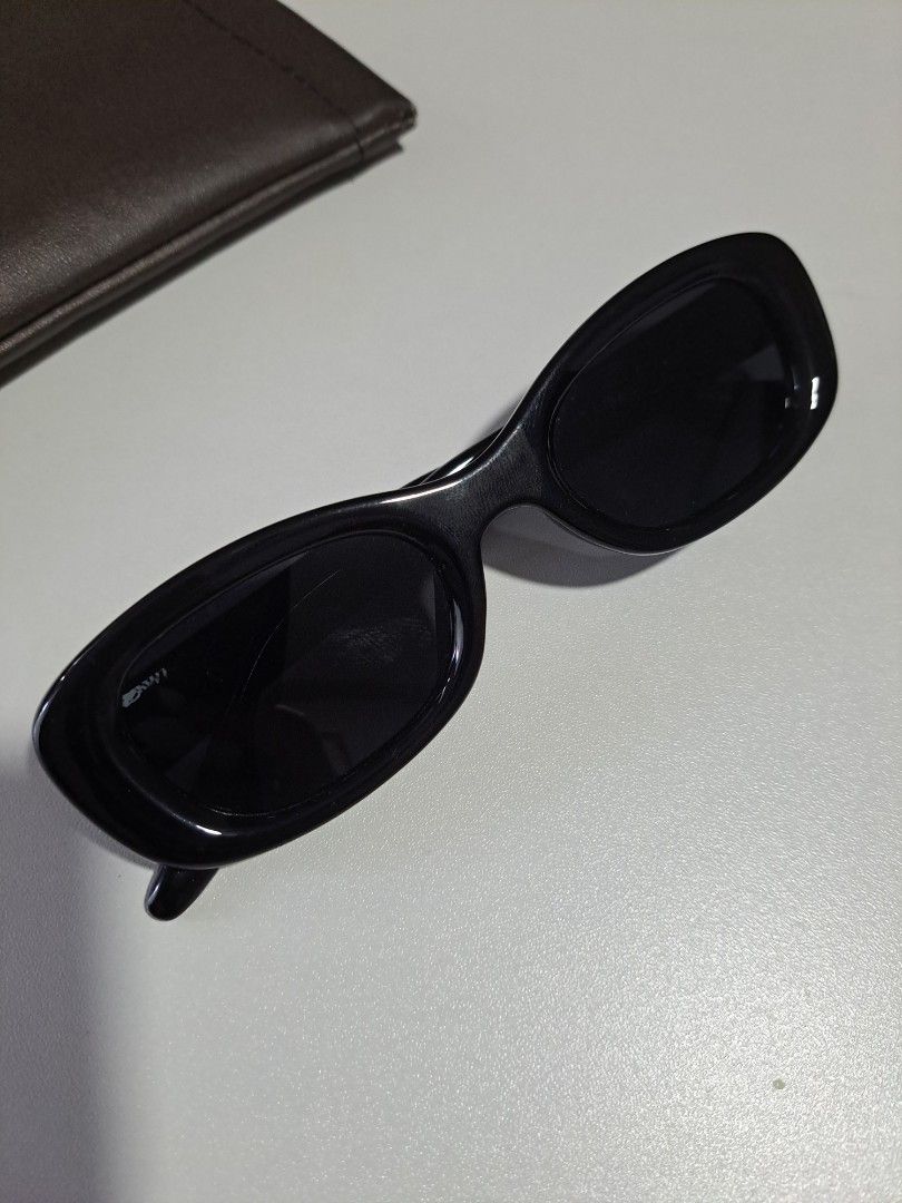 Tambu Sunglasses Black (Category: Sunglasses & Eyewear) located in Pasig City. Submitted by aecollection03 (Listing ID 1469171832, Image 1). Description: - Brand/Model: Gentle Monster Tambu - Color: Classic black - Lenses: Dark tinted - Details: Gold inner temple lettering and metal side hinges - Style: Chic and versatile everyday eyewear - will provide hardcase for shipping.