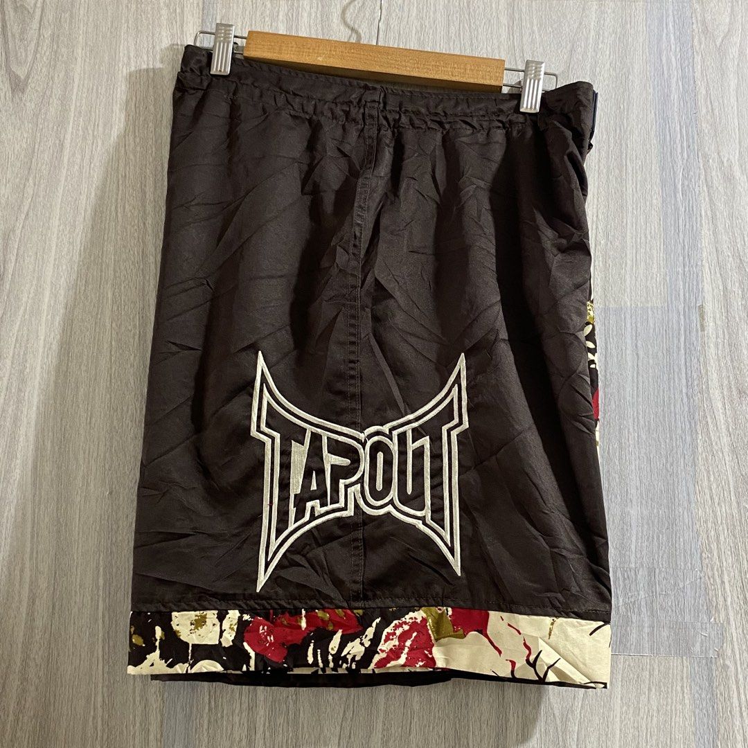 Tapout Floral Board Shorts (Category: Shorts) located in Manila. Submitted by _thriftanddrip (Listing ID 1469339808, Image 3). Description: Large 34 x 20 ₱750 free shipping Tapout board shorts with a split brown and floral pattern design. Large embroidered logos on the front and back. Red inside waist tag with brand lettering. Drawstring closure at the waist. Lightweight fabric, great for summer or casual wear. Clean condition overall..