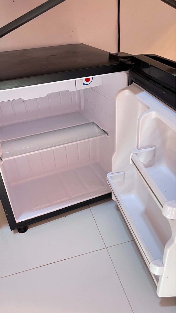 TCL 1.8 cu.ft. Single-Door Refrigerator TR-59PHB REF (Category: Refrigerators and Freezers) located in Famy. Submitted by princessbieber (Listing ID 1469218846, Image 3). Description: Lightly used TCL refrigerator, perfect for dorms, apartments, or solo living. Details: • Model: TR-59PHB • 1.8 cu.ft. capacity • Lightly used • Small dent on the front door • Fully functional RFS: Upgrading to a bigger refrigerator and letting this one go. • Slightl