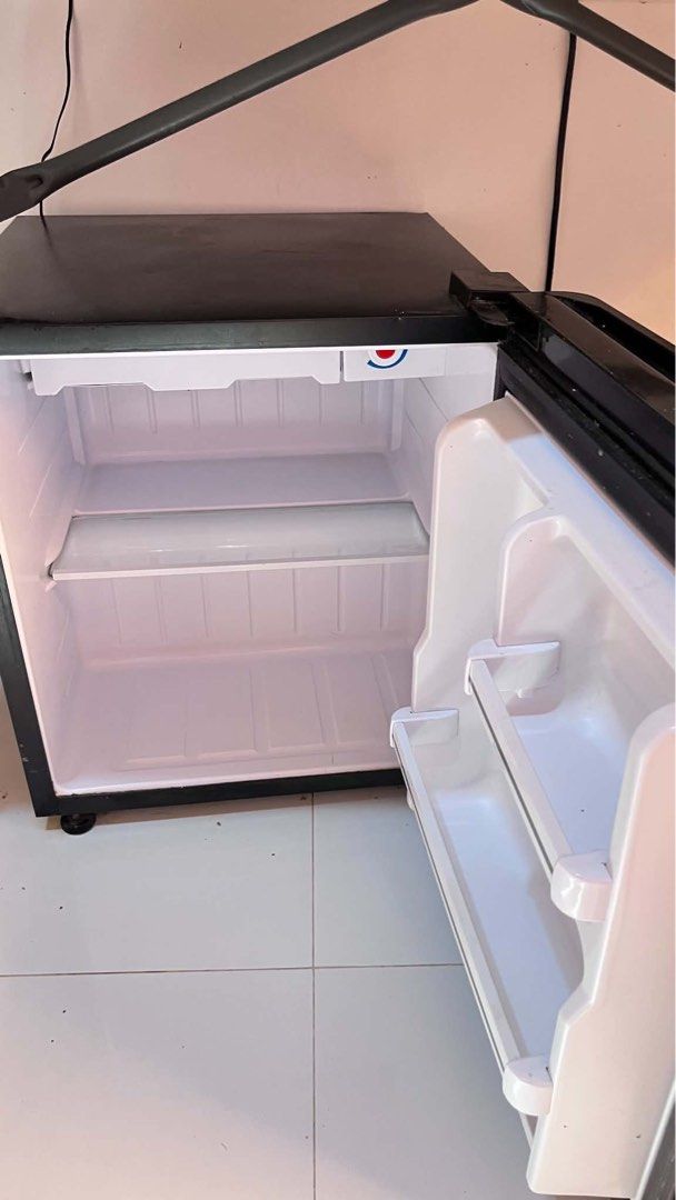 TCL 1.8 cu.ft. Single-Door Refrigerator TR-59PHB REF (Category: Refrigerators and Freezers) located in Famy. Submitted by princessbieber (Listing ID 1469218846, Image 2). Description: Lightly used TCL refrigerator, perfect for dorms, apartments, or solo living. Details: • Model: TR-59PHB • 1.8 cu.ft. capacity • Lightly used • Small dent on the front door • Fully functional RFS: Upgrading to a bigger refrigerator and letting this one go. • Slightl