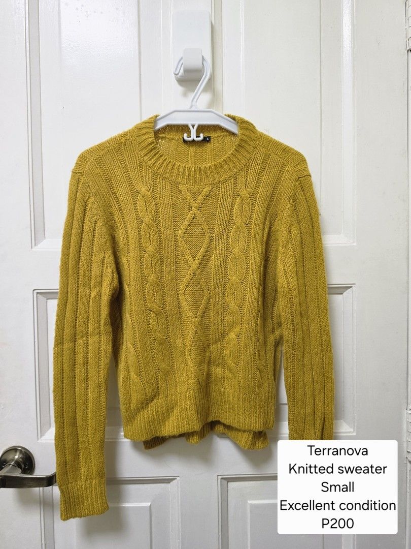 Terranova Knitted Sweater Small (Category: Longsleeves) located in Makati City. Submitted by momyrica (Listing ID 1469173409, Image 2). Description: - Brand: Terranova - Size: Small - Design: Classic cable knit pattern on the front with solid-colored knit fabric - Details: Ribbed crew neckline, cuffs, and hem - Cut: Trendy high-low hemline with side slits.