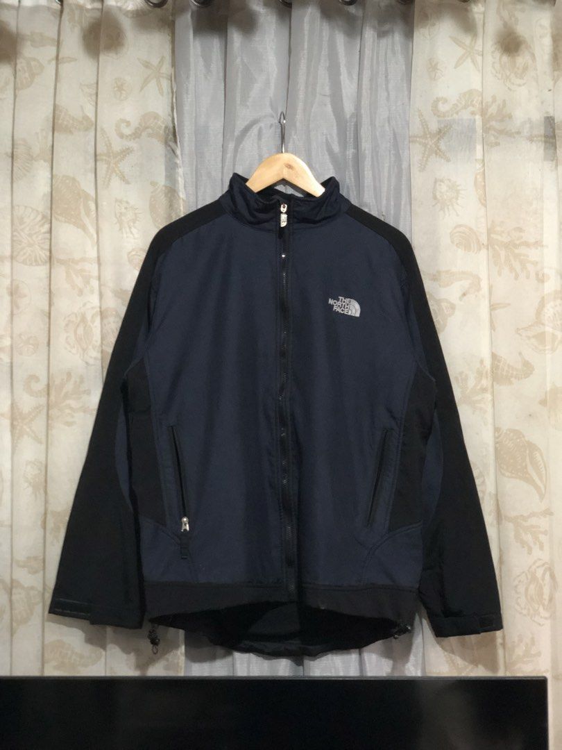 The North Face Fleece Lined Jacket Size L (Category: Coats, Jackets and Outerwear) located in Calbayog City. Submitted by thriftme.bro (Listing ID 1469324475, Image 1). Description: Authentic The North Face navy blue and black jacket in size Large with original tag attached. Features a full zip, cozy black fleece lining, secure hand pockets, and an adjustable drawstring hem..