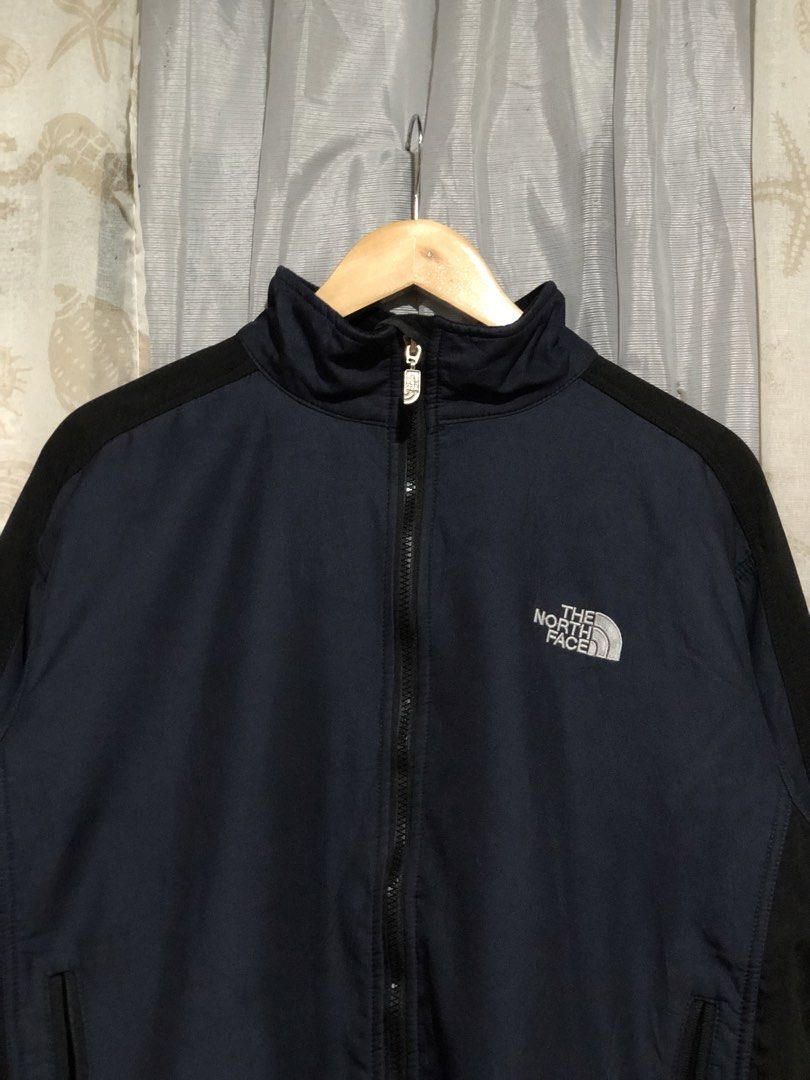 The North Face Fleece Lined Jacket Size L (Category: Coats, Jackets and Outerwear) located in Calbayog City. Submitted by thriftme.bro (Listing ID 1469324475, Image 2). Description: Authentic The North Face navy blue and black jacket in size Large with original tag attached. Features a full zip, cozy black fleece lining, secure hand pockets, and an adjustable drawstring hem..