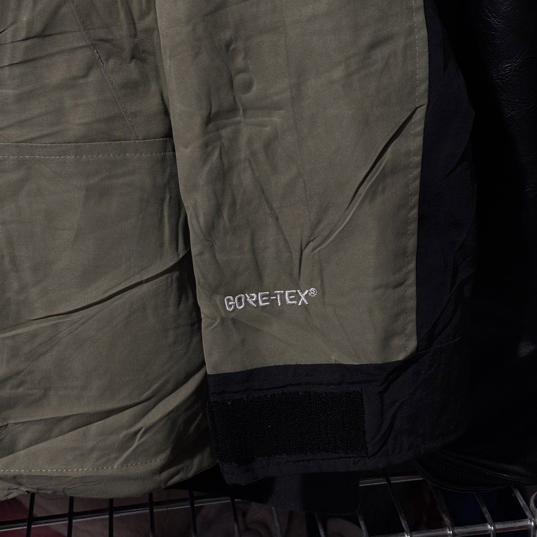 The North Face Gore-Tex Mountain Jacket (Category: Coats, Jackets and Outerwear) located in Caloocan City. Submitted by bonsatocha43876 (Listing ID 1469321643, Image 3). Description: - Brand: The North Face - Condition: Brand new with tags (BNWT) - Color: Olive Green and Black colorblock - Size: Men's Large (25" pit-to-pit, 28" length) - Material: Waterproof Gore-Tex shell - Features: Adjustable hood with drawstrings, embroidered logo on chest an