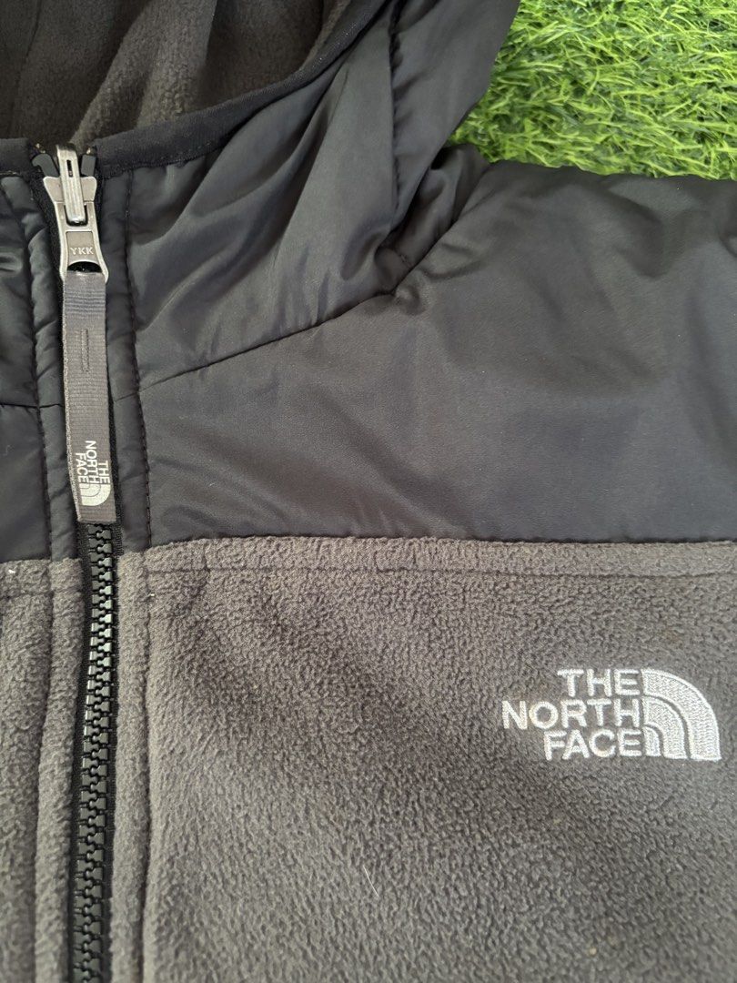 The North Face Reversible Puffer Jacket (Category: Coats, Jackets and Outerwear) located in Makati City. Submitted by rare_thrift_stuff (Listing ID 1469164787, Image 3). Description: - Brand: The North Face - Style: Reversible Jacket (Black puffer/grey fleece on one side, full grey fleece with black panel on the other) - Features: Attached hood, full zip closure with YKK hardware, embroidered white logos on both sides - Fit: Standard fit - Condit