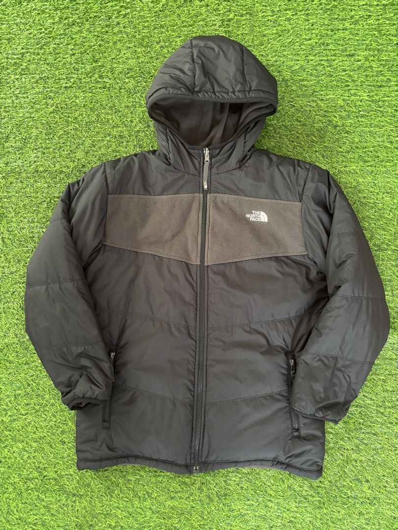 The North Face Reversible Puffer Jacket (Category: Coats, Jackets and Outerwear) located in Makati City. Submitted by rare_thrift_stuff (Listing ID 1469164787, Image 1). Description: - Brand: The North Face - Style: Reversible Jacket (Black puffer/grey fleece on one side, full grey fleece with black panel on the other) - Features: Attached hood, full zip closure with YKK hardware, embroidered white logos on both sides - Fit: Standard fit - Condit