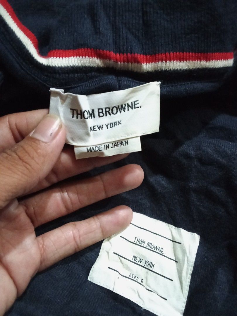 Thom Browne (Category: Hoodies) located in Manila. Submitted by tcbukay_zxc25 (Listing ID 1469337510, Image 2). Description: Thom Browne hoodie size 2 good condition issue minimal stain Thom Browne short size 5 issue stain.