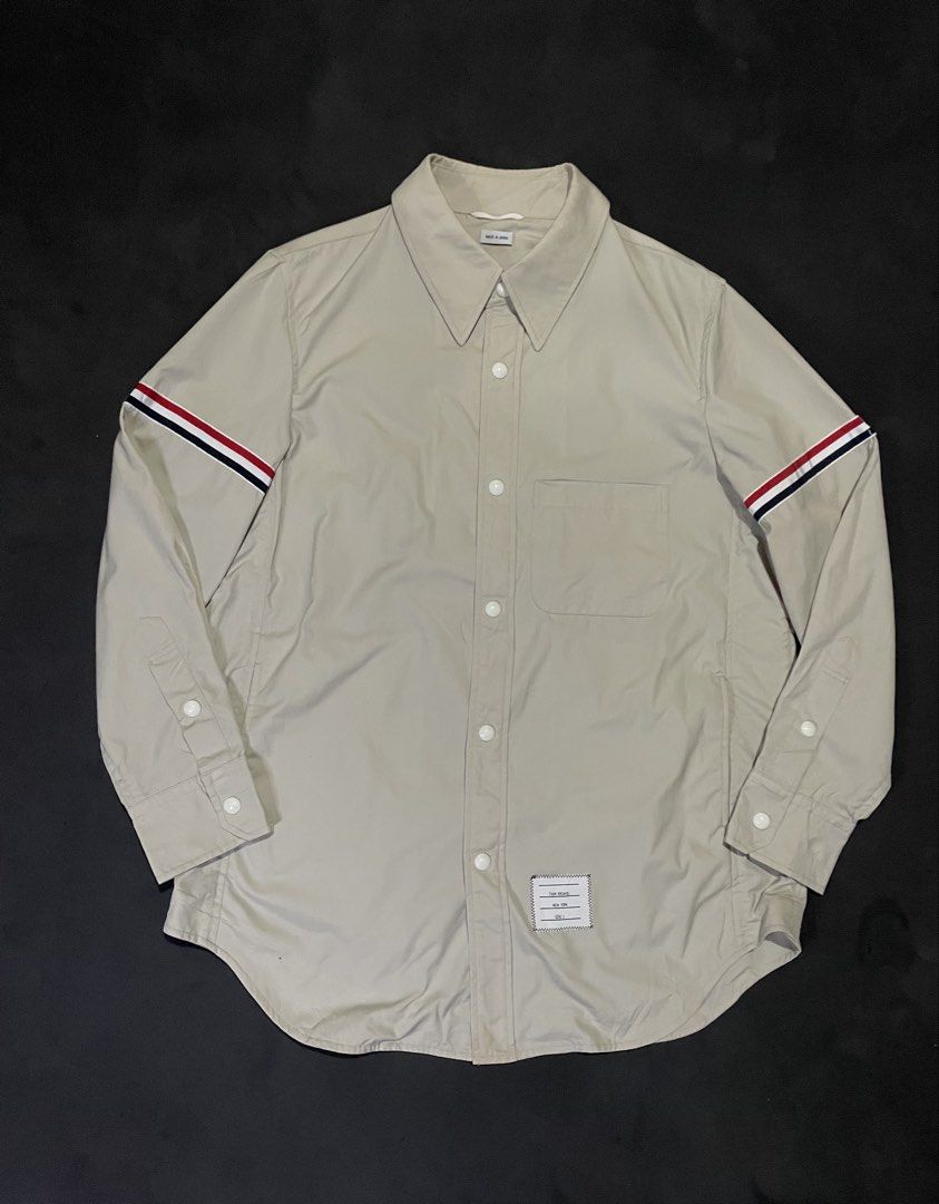 Thom Browne Nylon Shell Shirt Jacket with Armbands (Category: Luxury Apparel) located in Bocaue. Submitted by mosthighcollective (Listing ID 1469162647, Image 3). Description: Thom Browne Nylon Shell Shirt Jacket with Armbands Size: 2 on tag ( L to XL) Dimes: 23 width 29 length Good as new No issue 6,500 only Dm me to purchase 📥.