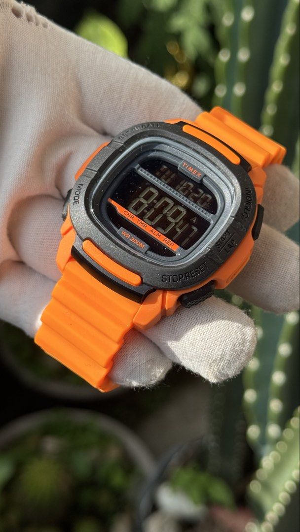 Timex Shock Resistant Digital Watch Orange TW5M26500 (Category: Men's Watches) located in Manila. Submitted by junjun12356 (Listing ID 1469163552, Image 3). Description: - Brand: Timex - Model: TW5M26500 - Color: Bright orange with black accents - Functions: Digital display, stopwatch, timer, alarm - Build: Durable resin strap and stainless steel back - Water Resistance: Up to 200 meters - Condition: Clean, tested, and working properly.