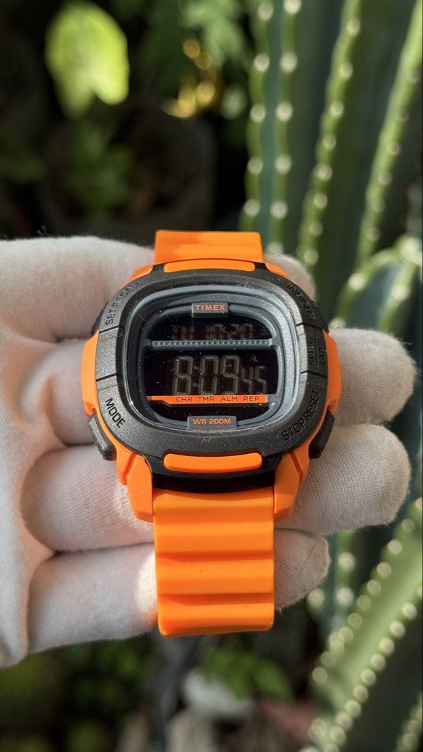 Timex Shock Resistant Digital Watch Orange TW5M26500 (Category: Men's Watches) located in Manila. Submitted by junjun12356 (Listing ID 1469163552, Image 2). Description: - Brand: Timex - Model: TW5M26500 - Color: Bright orange with black accents - Functions: Digital display, stopwatch, timer, alarm - Build: Durable resin strap and stainless steel back - Water Resistance: Up to 200 meters - Condition: Clean, tested, and working properly.