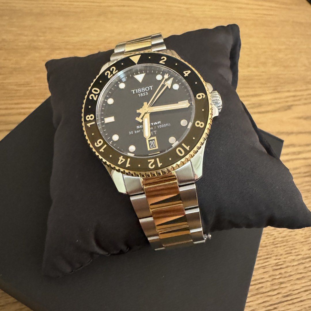 Tissot Seastar GMT Two-Tone Watch (Rootbeer) (Category: Luxury Watches) located in Pasig City. Submitted by mon.alcantara (Listing ID 1469257446, Image 2). Description: Strictly for pick up only. Strictly bank transfer payment only. - Brand: Tissot Seastar GMT - Finish: Two-tone steel and yellow gold - Dial & Bezel: Black dial with rotating bezel - Movement: Swiss quartz movement - Inclusions: Original box, extra bracelet links with pins, quickst