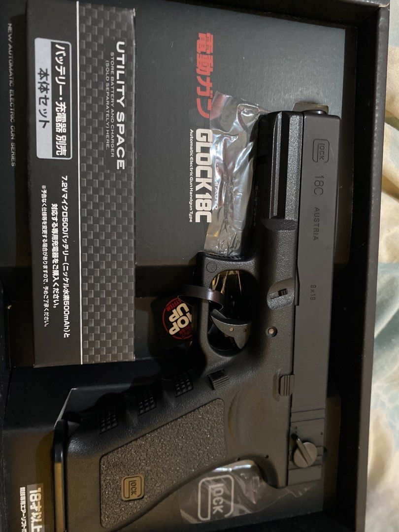 Tokyo Marui Glock 18C Automatic Electric Gun Handgun Type (Category: Action & Battle Toys) located in Manila. Submitted by devilsdontcry (Listing ID 1469162155, Image 1). Description: No battery n charger Hindi GBB untested Brandnew conditon - Brand: Tokyo Marui - Model: Glock 18C Automatic Electric Pistol (AEP) - Color: Black with authentic 9x19 caliber markings on the slide - Inclusions: Original box packaging, instruction manual, and hop-up sy