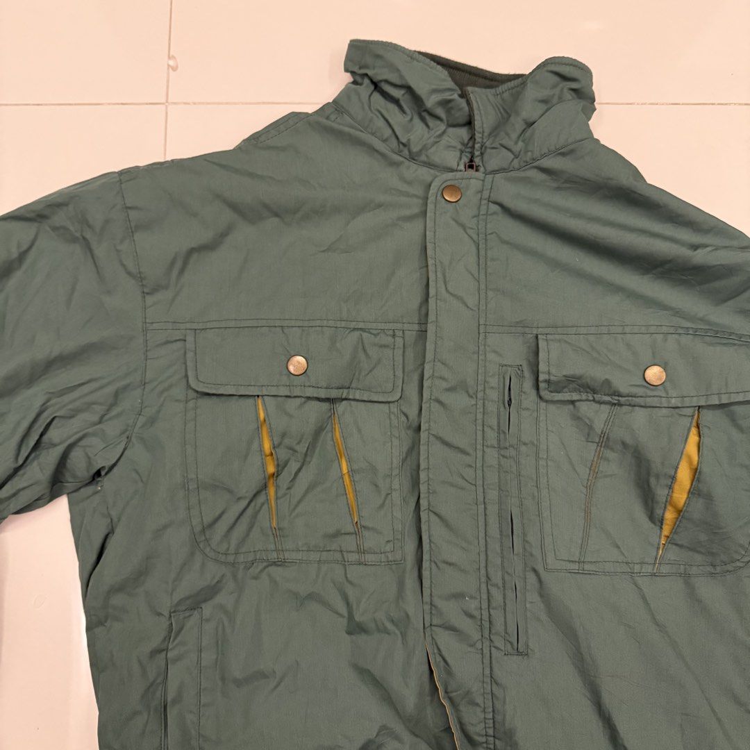 TOKYU Green Vintage Winter Jacket Size L (Category: Coats, Jackets and Outerwear) located in Paranaque City. Submitted by joeymon1 (Listing ID 1469280526, Image 2). Description: Rfs: not my style anymore - Brand: TOKYU - Size: Large - Color: Green with mustard yellow inner placket - Lining: Quilted for extra warmth - Pockets: Multiple front button-flap pockets and vertical chest zipper pockets .