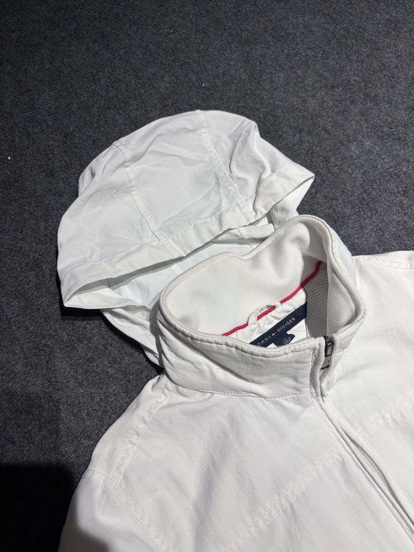 Tommy helfigher packable hood jacket (Category: Hoodies) located in Manila. Submitted by austinace04 (Listing ID 1469163084, Image 3). Description: Excellent condition Size Small on Tag 21 x 27 9.8/10 color rate Issue none.