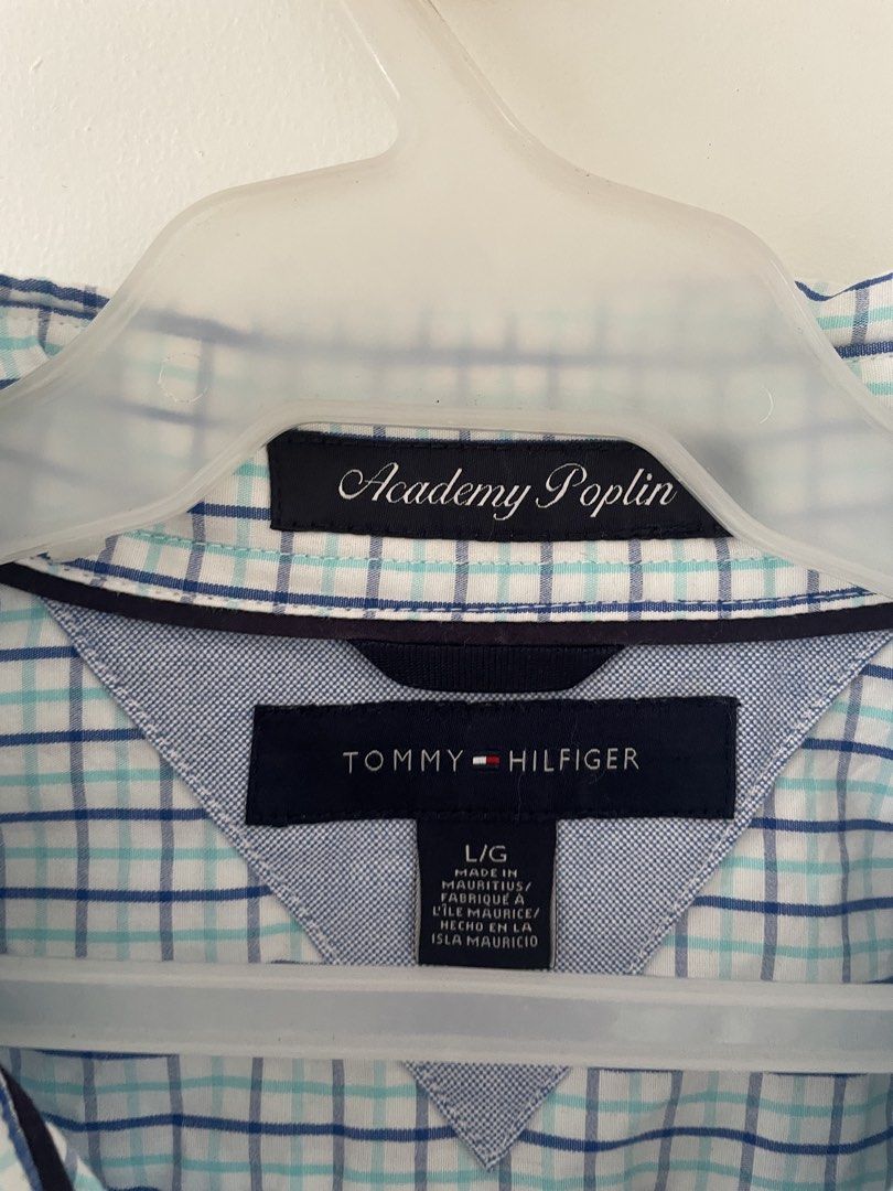 Tommy Hilfiger Long Sleeve - L (Category: Formal Shirts) located in Cainta. Submitted by pnedp2022 (Listing ID 1469212587, Image 3). Description: - Brand: Tommy Hilfiger - Style: Academy Poplin Long Sleeve Button-Up Shirt - Color: White base with blue and mint green plaid grid pattern - Size: Large - Material: Lightweight and breathable cotton poplin - Features: Left chest pocket with small embroidered logo flag, button-up front, and classic coll