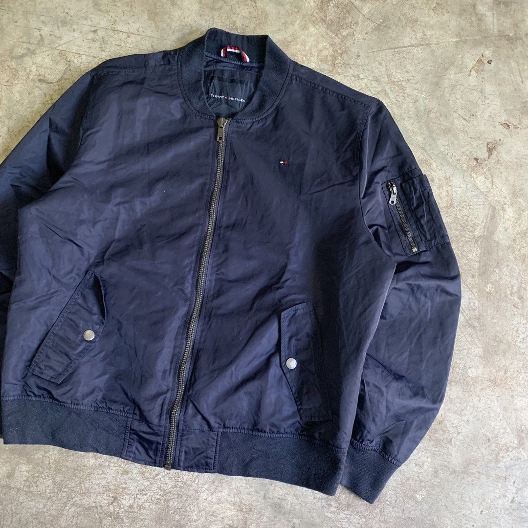 Tommy Hilfiger Navy Blue Bomber Jacket XL (Category: Coats, Jackets and Outerwear) located in Manila. Submitted by emplysthrift. (Listing ID 1469294910, Image 2). Description: Width "26.5 Length "27 Good Condition Colorrate: 9.5/10 Flaws: None Unli vouch/vc for safe transactions 📲 Location: Laspinas City, Metro Manila, Brngy Talon Uno. 📍 DM IF INTERESTED📥 - Brand: Tommy Hilfiger - Style: Bomber jacket - Color: Dark navy blue - Size: Men's XL -