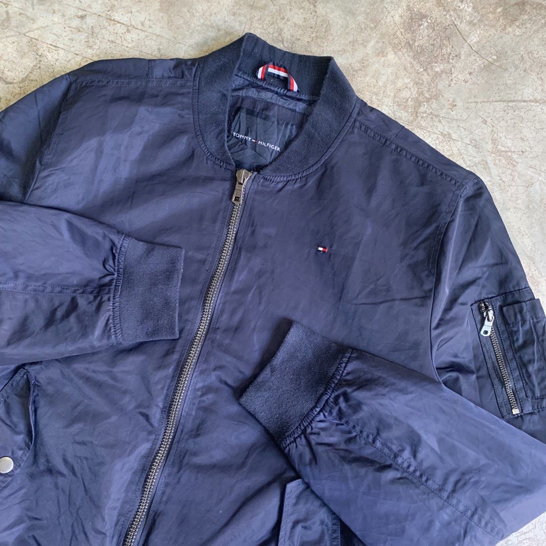 Tommy Hilfiger Navy Blue Bomber Jacket XL (Category: Coats, Jackets and Outerwear) located in Manila. Submitted by emplysthrift. (Listing ID 1469294910, Image 3). Description: Width "26.5 Length "27 Good Condition Colorrate: 9.5/10 Flaws: None Unli vouch/vc for safe transactions 📲 Location: Laspinas City, Metro Manila, Brngy Talon Uno. 📍 DM IF INTERESTED📥 - Brand: Tommy Hilfiger - Style: Bomber jacket - Color: Dark navy blue - Size: Men's XL -