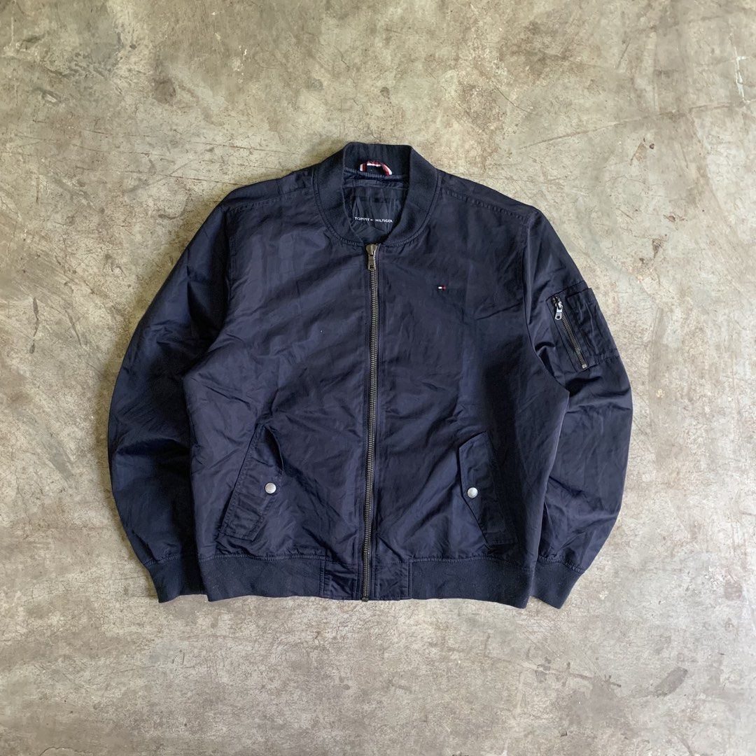 Tommy Hilfiger Navy Blue Bomber Jacket XL (Category: Coats, Jackets and Outerwear) located in Manila. Submitted by emplysthrift. (Listing ID 1469294910, Image 1). Description: Width "26.5 Length "27 Good Condition Colorrate: 9.5/10 Flaws: None Unli vouch/vc for safe transactions 📲 Location: Laspinas City, Metro Manila, Brngy Talon Uno. 📍 DM IF INTERESTED📥 - Brand: Tommy Hilfiger - Style: Bomber jacket - Color: Dark navy blue - Size: Men's XL -