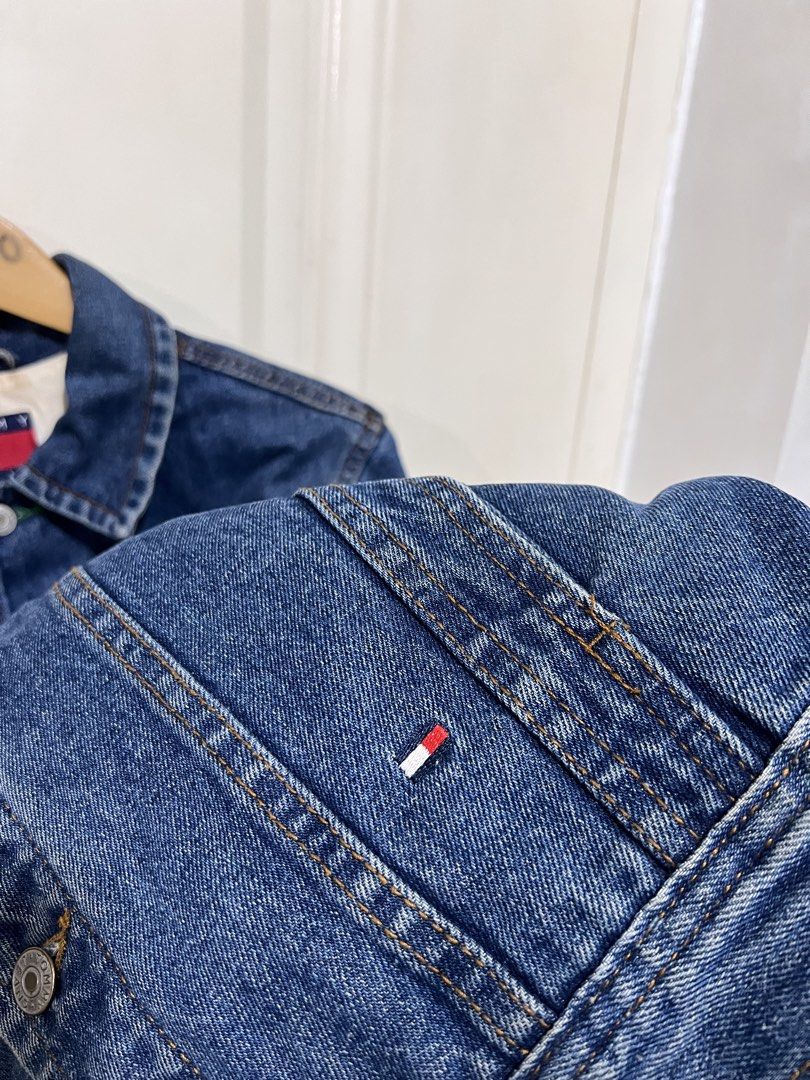 Tommy Jeans Denim Jacket with Back logo (Category: Coats, Jackets and Outerwear) located in San Pedro. Submitted by _eyamarieii (Listing ID 1469353527, Image 2). Description: Tommy Hilfiger Jeans Denim Jacket Excellent condition Color rate 9.5/10 No issue Need wash only Size XS ontag Width 19.5 Length 24 1500+sf.
