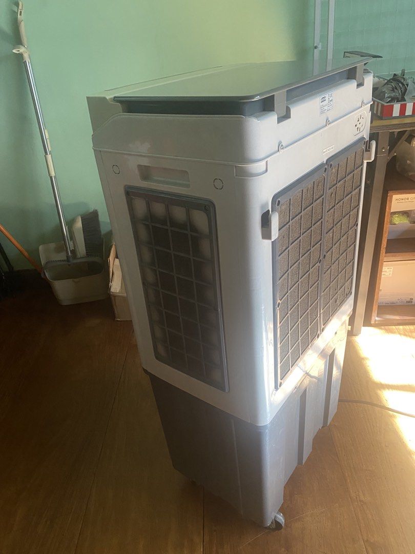 Tornado Blaster MT-21A2 Air Cooler (Category: Air Conditioning and Heating) located in Manila. Submitted by red_door_crafts (Listing ID 1469176216, Image 2). Description: Stay cool and comfy with the Tornado Blaster MT-21A2 Air Cooler in stylish grey and white! - Power: Energy-saving 80W, 220V, 60Hz - Performance: Powerful 4000 m3/h airflow with multi-speed settings, swing function, and cool mode - Convenience: Top-opening lid for easy water tank