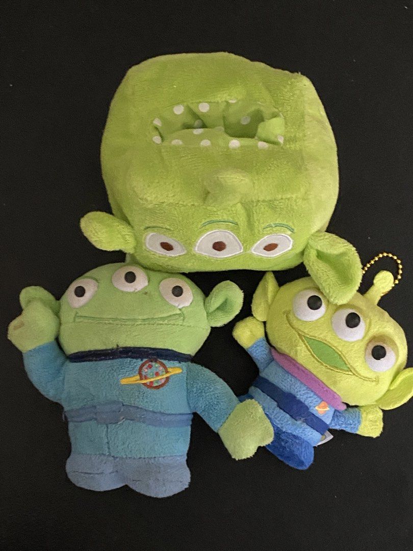 Toy Story Aliens Plush Bundle Tissue Box Keychains (Category: Plushies & Soft Toys) located in Davao. Submitted by hoowans_surplus (Listing ID 1469279551, Image 1). Description: - Authentic Disney Pixar Toy Story Alien plush bundle (Set of 3) - Includes: Green box pouch/tissue holder, blue space suit plush with T-Arts tag, and keychain plush with gold ball chain - Made from ultra-soft, high-quality fabric in vibrant green and blue colors - Perfec