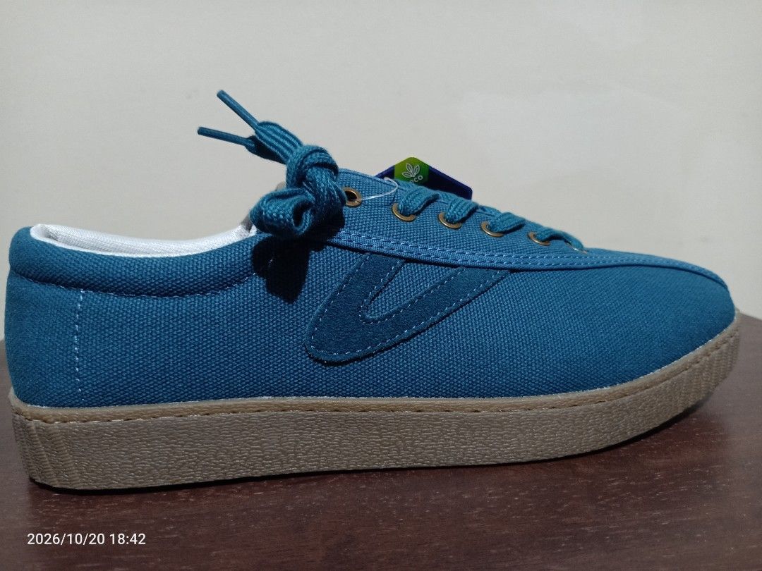 Tretorn Nylite plus Canvas Sneakers (Category: Sneakers) located in Las Pinas. Submitted by OmengSoyT (Listing ID 1469309172, Image 1). Description: - Brand: Tretorn Sweden - Condition: Brand new with original tag attached.Guaranteed Authentic - Color: Teal blue with brown rubber soles and matching laces - Comfort: OrthoLite comfort foam insoles - Details: Metal eyelets on the sides and branding on the heel and sole.