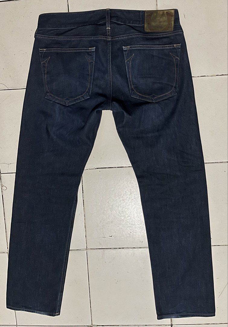 True Religion GENO RAW DENIM (Category: Jeans) located in Cebu City. Submitted by rockall24455 (Listing ID 1469298122, Image 3). Description: - Brand: True Religion - Style: Dark wash denim jeans - Origin: Made in USA - Size: 36 - Closure: Classic button fly - Details: Signature horseshoe back pockets, branded leather patch, and Buddha graphic inner pocket lining - Condition: Clean dark indigo wash with minimal fading - Mode of Payment: GCash or 