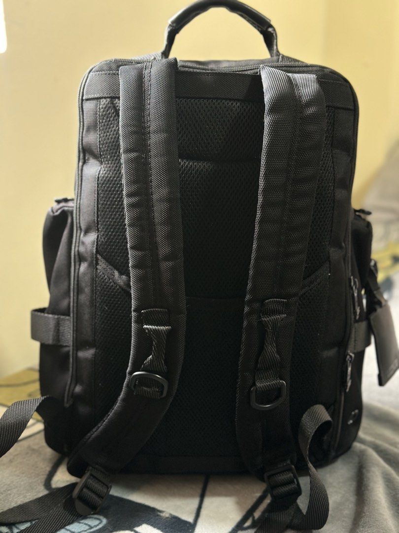 TUMI Alpha 3 Brief Pack Black Business Laptop Backpack (Category: Luxury Bags & Wallets) located in Baguio. Submitted by annecicat (Listing ID 1469227231, Image 3). Description: Tumi Alpha 3 backpack in black ballistic nylon. Premium travel and daily carry bag. Multiple exterior zipped pockets for quick access. Leather accent details on the front pocket. Padded shoulder straps and sturdy top grab handle. Side utility pockets included. Clean inter