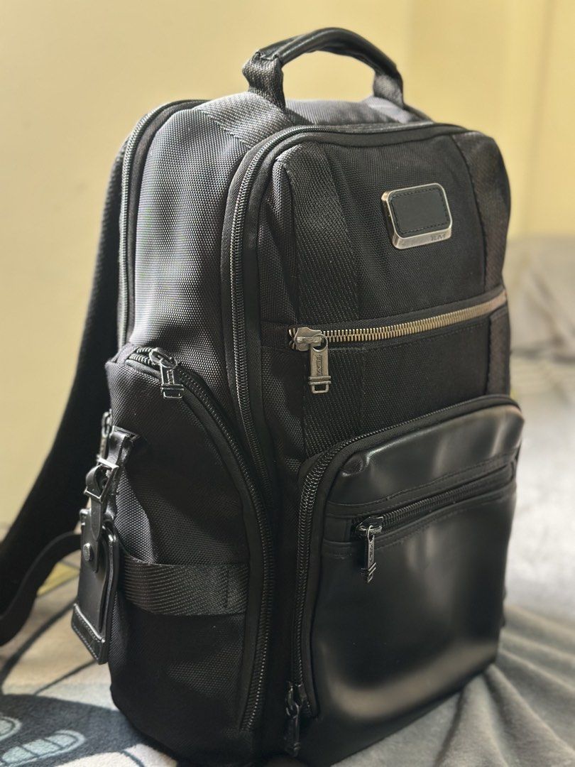 TUMI Alpha 3 Brief Pack Black Business Laptop Backpack (Category: Luxury Bags & Wallets) located in Baguio. Submitted by annecicat (Listing ID 1469227231, Image 2). Description: Tumi Alpha 3 backpack in black ballistic nylon. Premium travel and daily carry bag. Multiple exterior zipped pockets for quick access. Leather accent details on the front pocket. Padded shoulder straps and sturdy top grab handle. Side utility pockets included. Clean inter