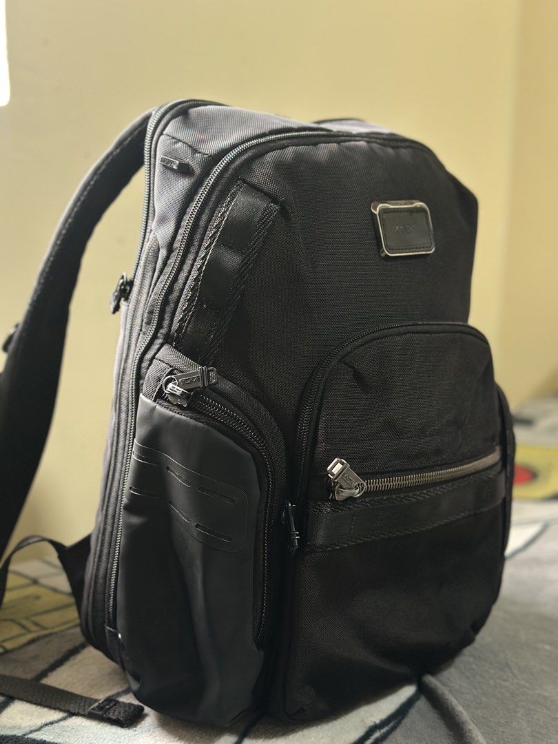TUMI Alpha Bravo Nathan Backpack Black KOBE Monogram (Category: Luxury Bags & Wallets) located in Baguio. Submitted by annecicat (Listing ID 1469227668, Image 2). Description: - Brand: Tumi Alpha Bravo - Material: Solid black ballistic nylon - Customization: Metal plaque engraved with the name 'KOBE' - Storage: Multiple exterior zippered compartments, side utility pockets, and clean interior lining - Comfort: Padded shoulder straps with D-rings, 