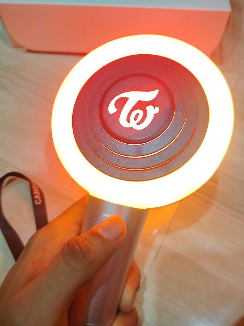 TWICE Candybong Z Official Lightstick with Box (Category: K-Wave Merchandise) located in Cainta. Submitted by emisshopping (Listing ID 1469174552, Image 3). Description: - Official TWICE Candybong Z lightstick - Tested and 100% working, lights up with the iconic TWICE logo - Comes with the original white box and attached wrist strap - RFS: Vet bills :(.