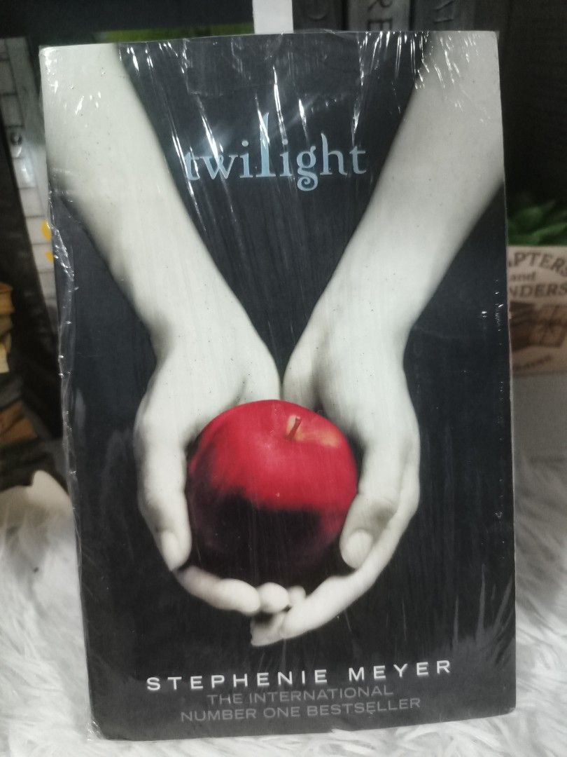 Twilight by Stephenie Meyer paperback novel (Category: Storybooks) located in Cabuyao City. Submitted by chaptersandwonders143 (Listing ID 1469311518, Image 1). Description: - Title: Twilight by Stephenie Meyer - Publisher: Atom - Format: Paperback with iconic red apple cover - Protection: Wrapped in a protective plastic film - Perfect for fans of supernatural romance and the Bella & Edward saga.