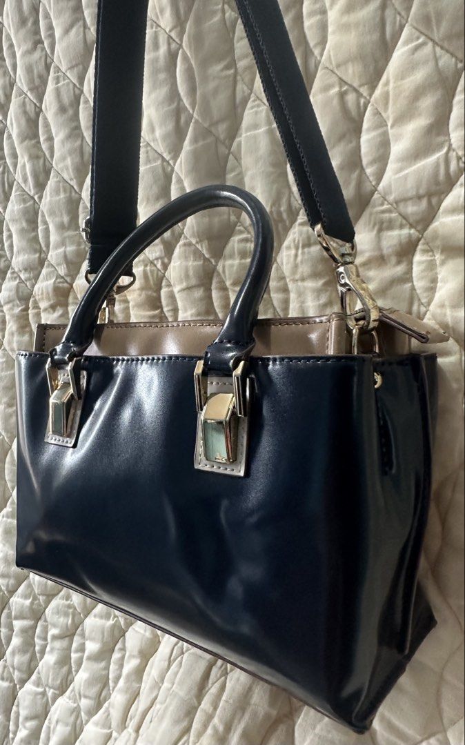2 Tone Sling Bag two way from Japan! (Category: Luxury Bags & Wallets) located in Santa Rosa. Submitted by esplanamur03635 (Listing ID 1469233056, Image 3). Description: Chic two-tone navy blue and taupe patent handbag and Sling bag Super gold hardwares detachable/adjustable webbed strap structured, organized interior Clean inside and out 3 compartments mid zip closure/2 magnetic clasp sides small but roomy no flaws good condition very minimal si