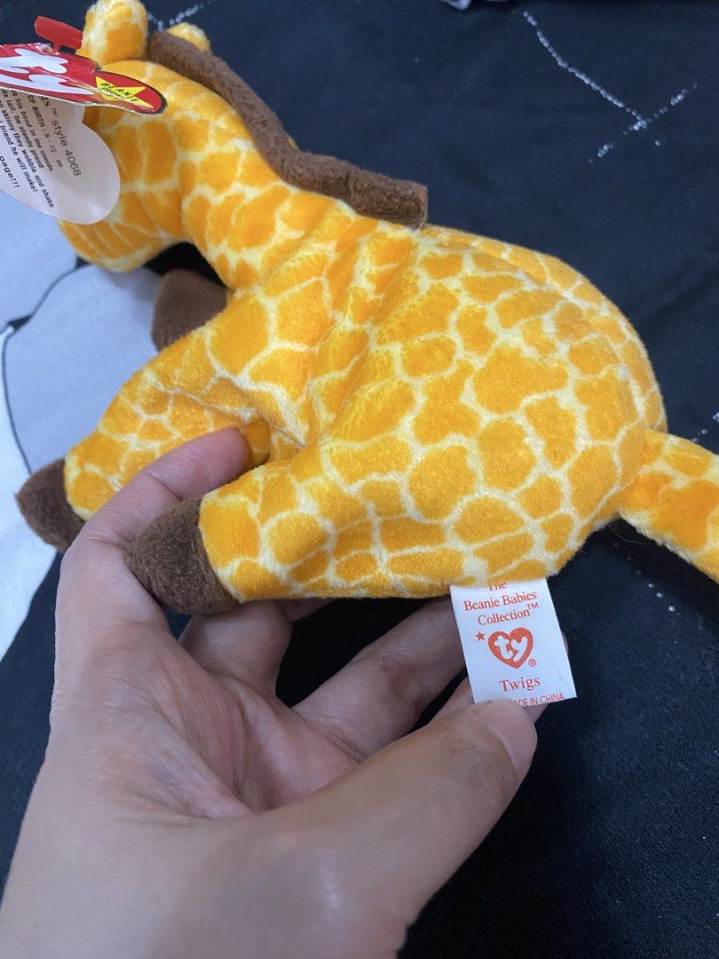Ty beanie original baby twigs (Category: Plushies & Soft Toys) located in Santa Maria. Submitted by jordangail (Listing ID 1469252391, Image 3). Description: Rare ty 😍😍😍 - Brand: Ty Beanie Original Baby - Character: Twigs the Giraffe (Style 4068) - Birth Date: May 19, 1995 - Features: Vibrant yellow and brown giraffe pattern with soft plush material - Tags: Comes with original heart hang tag and tush tag - Condition: Well-maintained and clean 